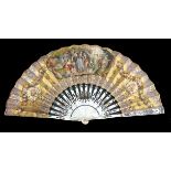 A mid-19th century white Mother of Pearl fan, the sticks gilded and silvered with flowers, the doubl