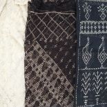 Two Azute or Assyut shawls, 1920’s, the first in black having an unusual design of large rectangles