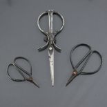 Antique Scissors: Three early pairs, in increasing sizes, the first two quite simple, the third with