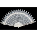 An early 19th century European ivory brisé fan, very finely carved with gothic tips to all sticks, t