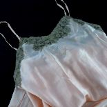 Lingerie: from the 20’s to 40’s’s, a selection of silk and satin nightwear and lingerie in soft peac