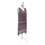 A 1920’s French beaded flapper dress, the lilac cotton gauze covered with clear beads, supplemented