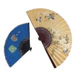 Two large Chinese paper fans, both with lacquered and gold painted guards, the first a painting in s