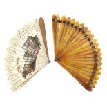 An early 19th century Peau d’ane or cream card Italianate souvenir fan, the guards of light wood, bo
