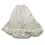 Two Edwardian cream silk underskirts with trained hems, the lower section fashioned with machine lac