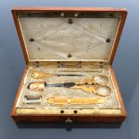 A very elegant and compact sewing set in polished wood/fitted box, most likely 19th century, contain