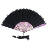 A c 1870’s black lace fan mounted on Mother of Pearl dyed a vibrant purple, the floral lace leaf wit