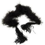 A substantial early 20th century black ostrich feather boa with elaborate long knotted tassels and f