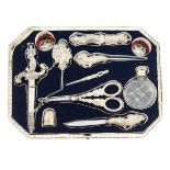 A fine 19th century white metal sewing set which has passed through several generations of the same