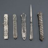 Four ornate antique needle cases, in white metal, one marked 925, being the one fitted with a chain