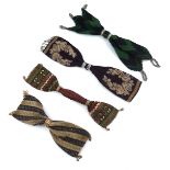 Four large 19th century miser’s or stocking purses featuring different designs and techniques, one o