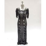 A 1920’s dropped waisted chiffon Flapper dress, and a 1930’s black lace evening gown, full length, c