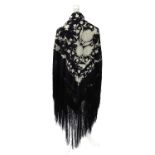 A black silk Chinese Canton shawl embroidered throughout in white silk, the corners worked with the
