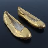 A pair of gold leather shoes for a young girl, leather soled with part cream kid lining, warranted a