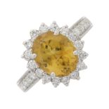 An 18ct gold chrysoberyl and diamond cluster ring