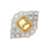 A platinum yellow sapphire and diamond dress ring