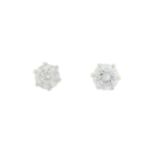 A pair of brilliant-cut diamond single-stone stud earrings