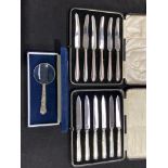 Flatware including two silver plate butter knives sets, and a magnifying glass cased (3)