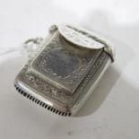 An Edward VII silver vesta case, William Light, Birmingham 1906, single hinged lid with rigid