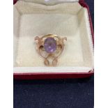 An Art Nouveau 9ct gold amethyst openwork brooch