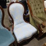 A Victorian mahogany spoonback fireside chair, on ceramic casters, 85cm high
