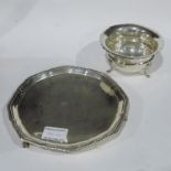 An Edwardian Sheffield silver circular waiter, 1908, on triple ball and claw feet, with a George V