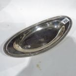 A George V silver oval tray, Barker Brothers Silver Ltd, Birmingham 1931, pierced border, 36cm long,