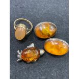 A selection of amber jewellery, together with a 9ct gold peach quartz cabochon dress ring