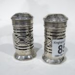 A pair of George V silver pepperettes, Birmingham 1925, 6cm high (2)