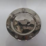 After Archibald Knox, a Tudric pewter plate, the b