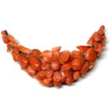 A 19th century coral brooch, of crescent form carv