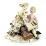 A Meissen figure group, Salesman and Lady,