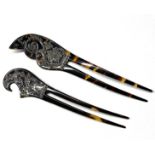 A pair of early 20th century celluloid hair pins,