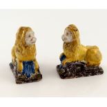 A pair of 18th century faience lions