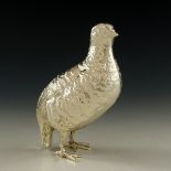 A silver plated sculptural bird,