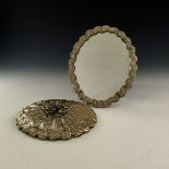 A pair of Ottoman silver mirrors, oval form, embos
