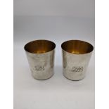 A pair of late 18th/early 19th century Portuguese silver beakers, gilt interior, marks to base,