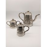 An Indian silver three piece tea set, 728g, H.15cm (teapot)