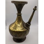 An 18th century or earlier brass ewer, India or Nepal, H.27cm