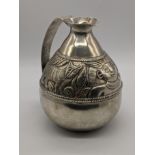 A 19th century Spanish Colonial silver water jug (Jarro), chased with a band of figural studies