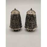A pair of Eastern silver pepper and salt, stamped Sterling 925 to base, 115g, H.6.5cm