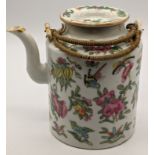 An early 20th century Chinese Peranakan porcelain teapot, decorated with auspicious fruit, bird