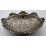 A Persian white metal bowl with Islamic calligraphy, L.17.5cm