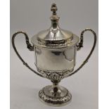 An early 20th century silver twin handled cup with lid, gilt interior, hallmarked Chester, 1911,