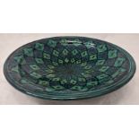 A large Middle Eastern green ground pottery bowl, D.40cm
