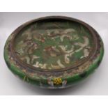 A large early 20th century Chinese green ground cloisonne dish depicting fish, mark to base, D.30cm