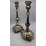 A pair of Middle Eastern silver candlesticks,raised on 3 feet, stamped ST925, 545g, H.33cm