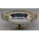 An early 20th century silver fruit dish, pierced border, raised on oval shaped base, hallmarked