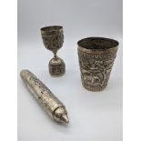 An Indian silver tumbler, decorated with elephant and rabbits,H.9cm, together with a pierced