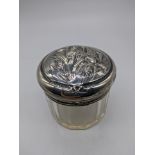 An Art Nouveau silver topped glass jar depicting flowers, hallmarked London, 1904, maker Charles